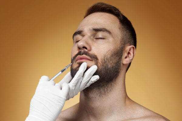 portrait-man-receiving-enhancements-tweakments-through-help-cosmetic-procedures